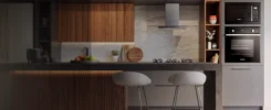 Cozinha de luxo, com eletrodomésticos de alto padrão. Bancada e acabamentos de madeira.